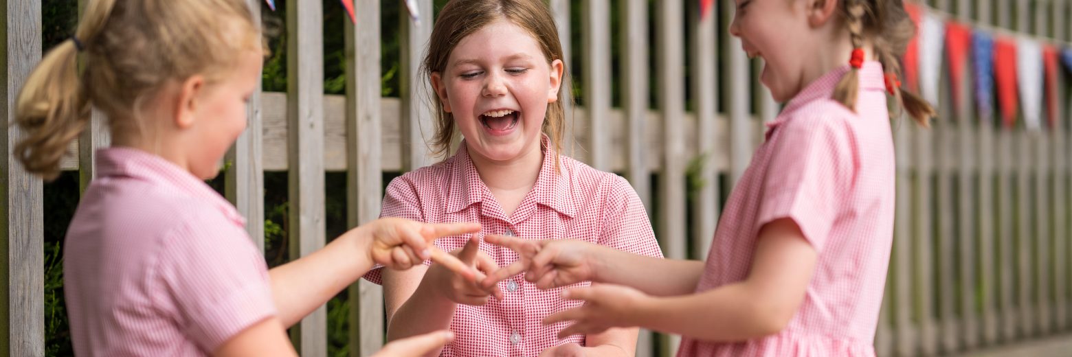 Children playing rock paper scissors