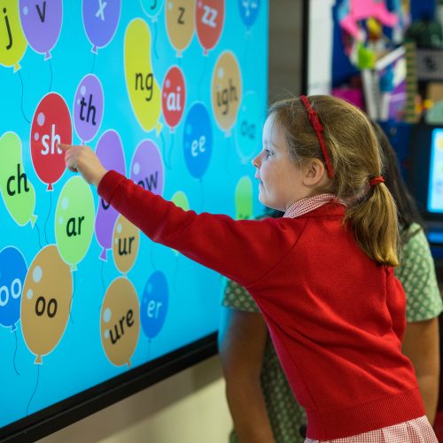 Student working with an interactive board