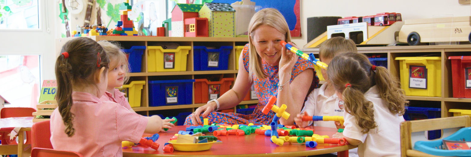 teacher working with students