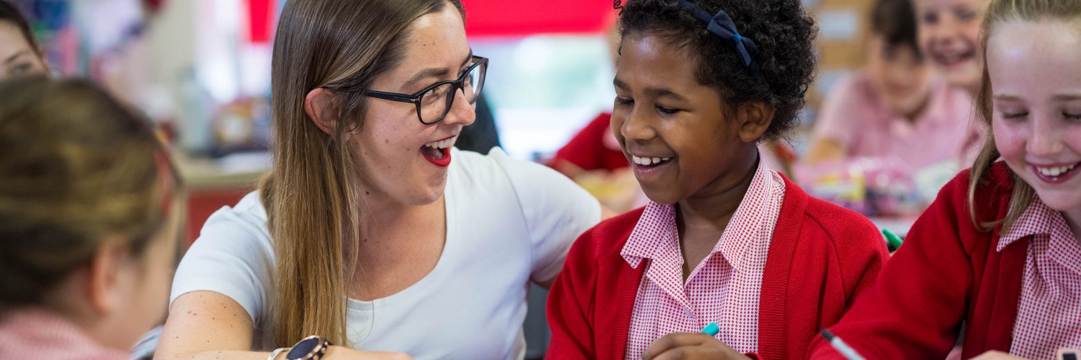 students working with their teacher