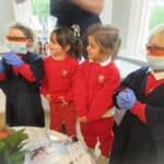 dentist showing toddlers his work