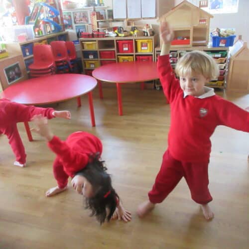 nursery students doing gymnastics poses