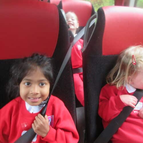 young students on a bus