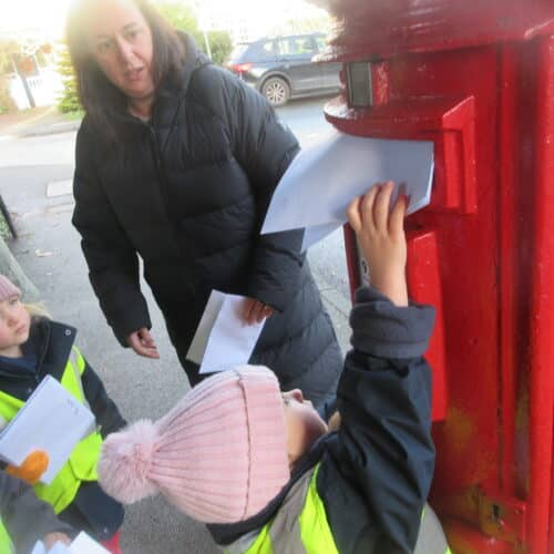 student posting a letter