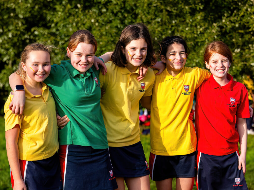 prep school girls supporting each other house cross-country st hilda's harpenden