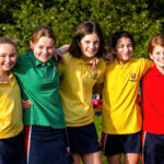 prep school girls supporting each other house cross-country st hilda's harpenden